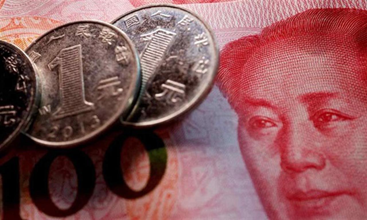 China's yuan slides near 16-year low as economy struggles